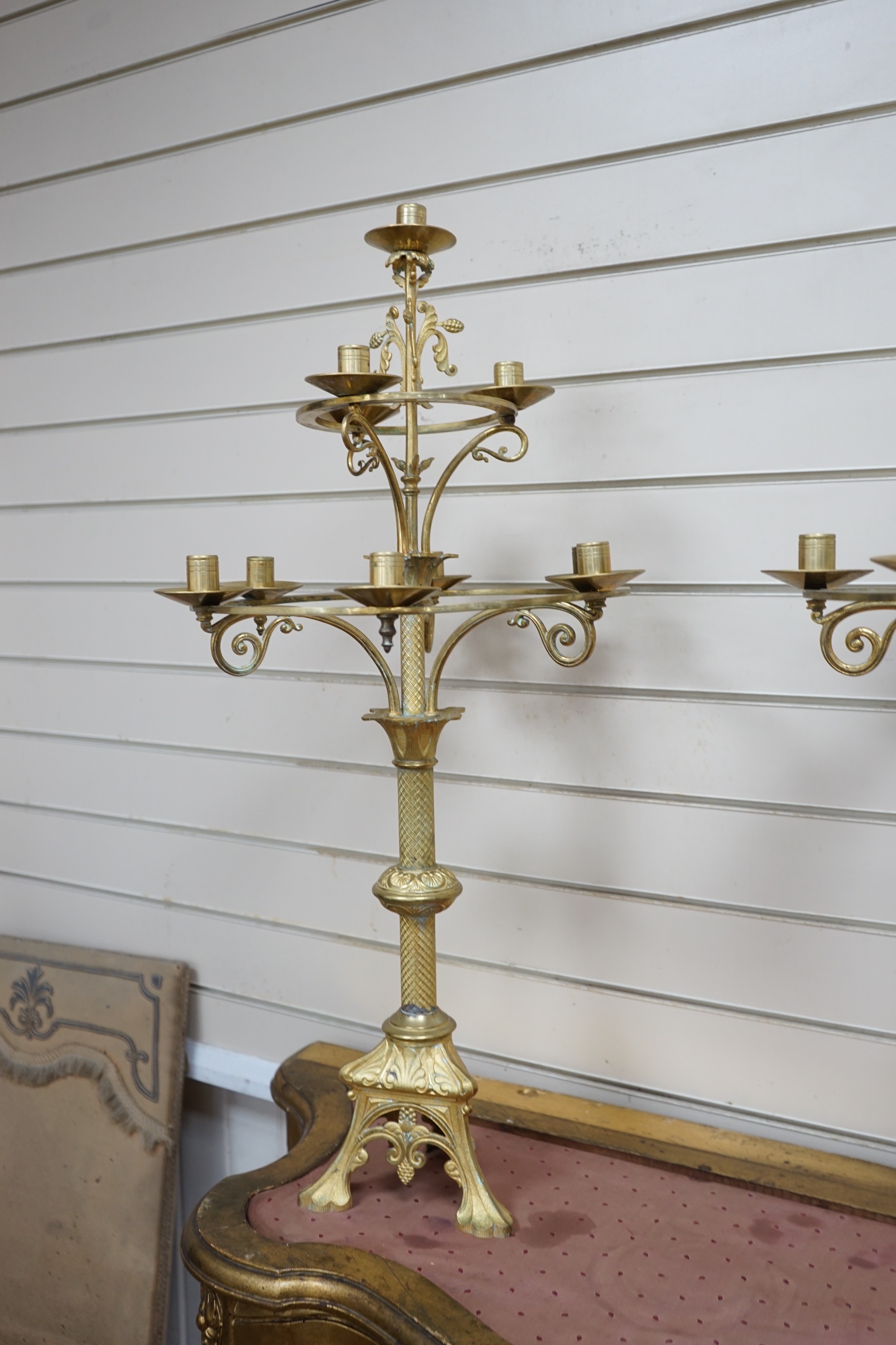 A pair of French neo-gothic ormolu two tier ten light candelabra. 83cm tall